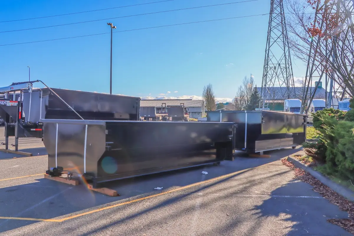 Roll-off dumpster ready for waste disposal at job site for Demolition Dumpster Rental in Belding